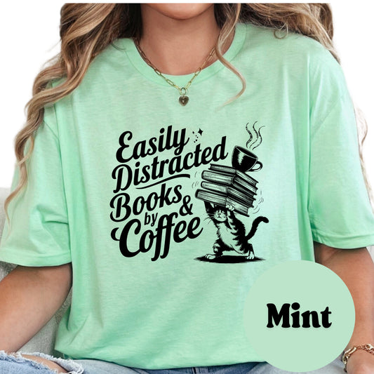 Easily Distracted by Books and Coffee Shirt – Funny Cat Book Lover Tee – Caffeine & Fiction Graphic Shirt – Gift for Readers and Coffee Addicts