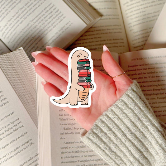 Cute Dino Dinosaur with Stack of Books – 3" Waterproof Bookish Sticker with Holo Overlay – Reading, Books, Reader Gift, Book Lover